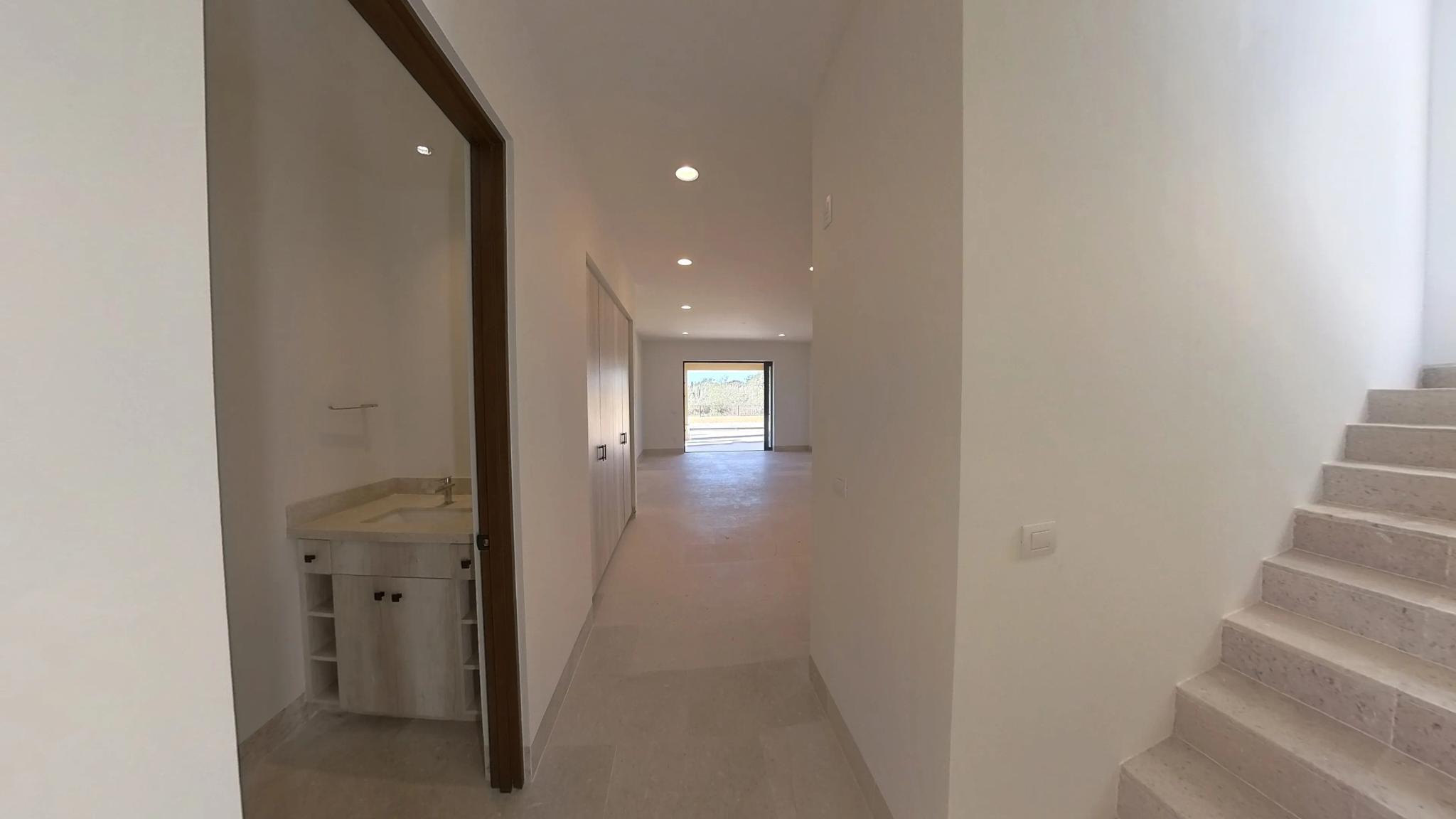 Hallway and staircase with minimalist design in the Mavila villa prototype