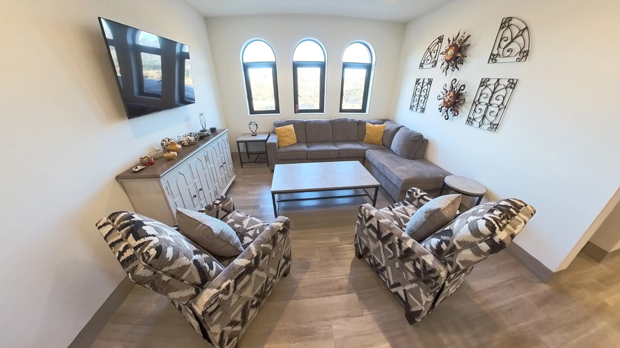 Cozy living room with modern furniture in the Mavila 2-bedroom prototype
