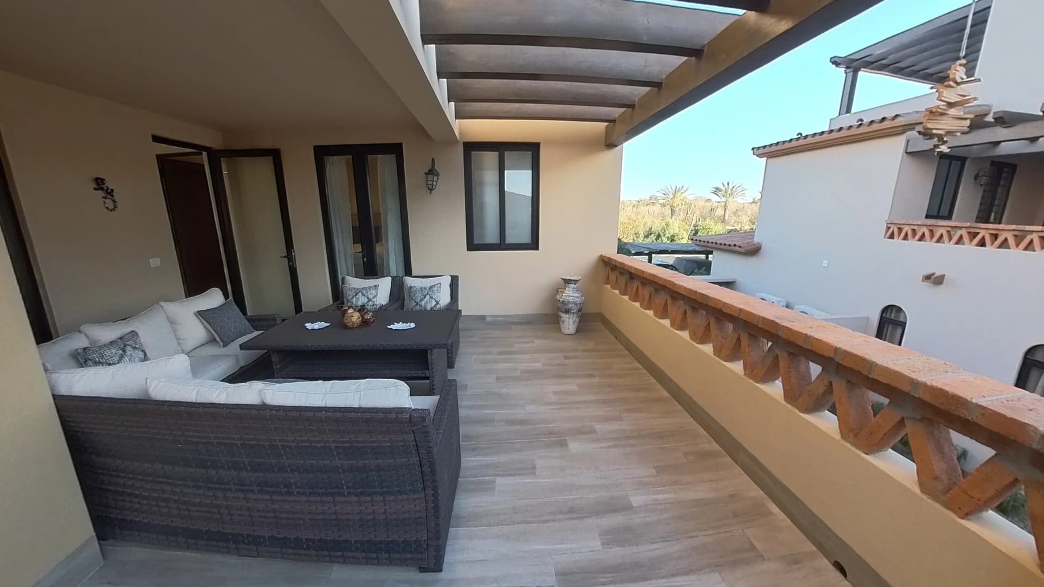 Private terrace with seating area in the Mavila 2-bedroom prototype