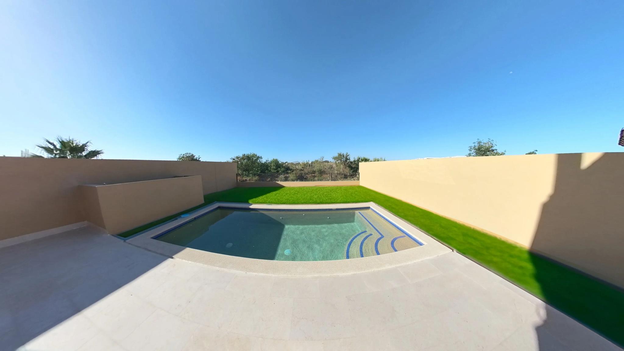 Private pool with landscaped surroundings in the Mavila villa prototype
