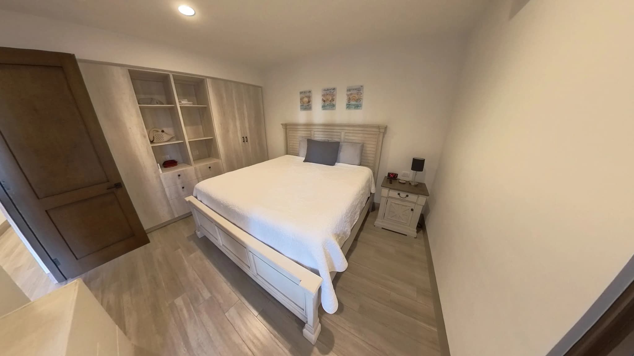 Bright master bedroom with built-in storage in the Mavila 2-bedroom prototype