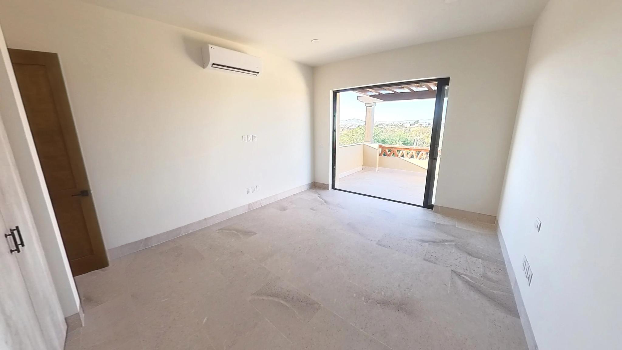 Bedroom with outdoor access and large window in the Mavila villa prototype
